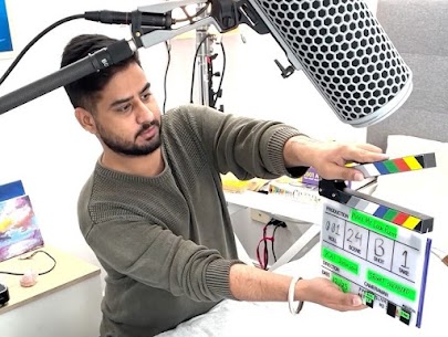 Man holding Movie Clapper Board